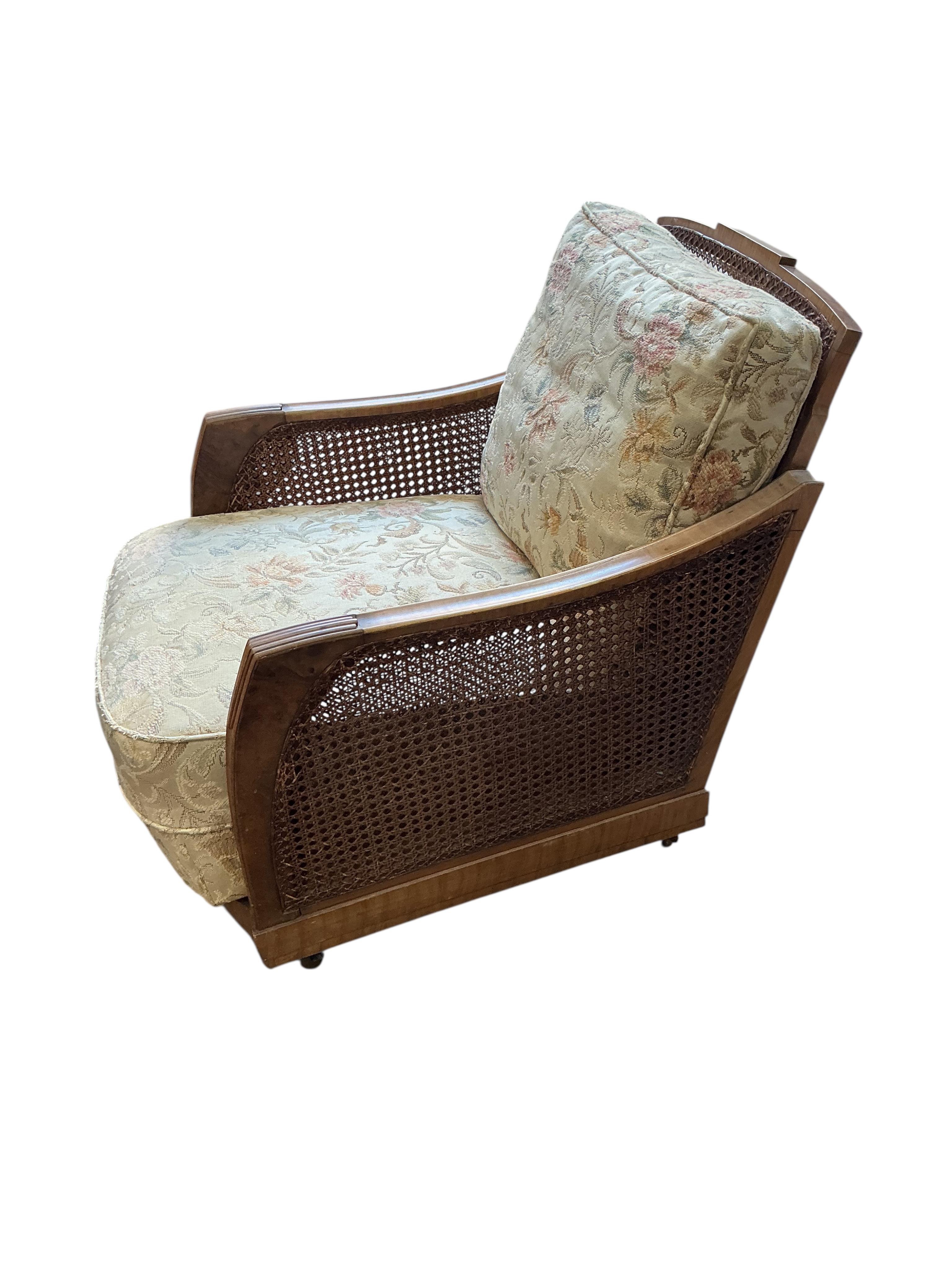 A Maple and Co. Art Deco walnut bergere armchair, width 66cm, depth 90cm, height 73cm